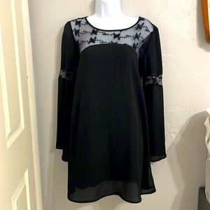 Long sleeve black dress with an open back that you can hide